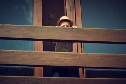 kid watching from balcony